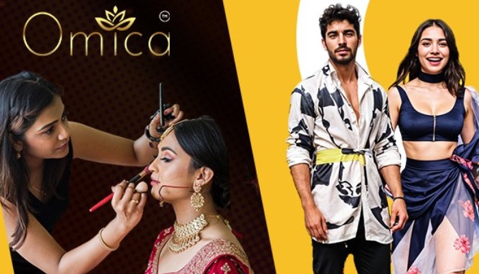 Makeup artist applying makeup to a beauty pageant contestant while two fully styled models pose in the background at an Omica beauty contest.