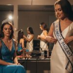 Beauty pageant contestants backstage, one adjusting "Omica Pageant" sash, another in deep thought, reflecting nerves and determination before competition.